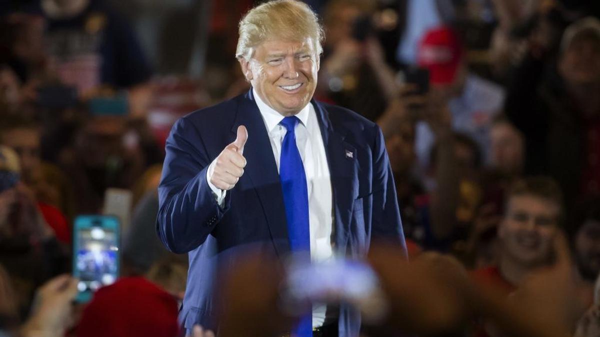 Republican presidential candidate Donald Trump gives a thumbs-up as he speaks during a campaign stop at the Savannah Center on Sunday, March 13, 2016, in West Chester, Ohio.