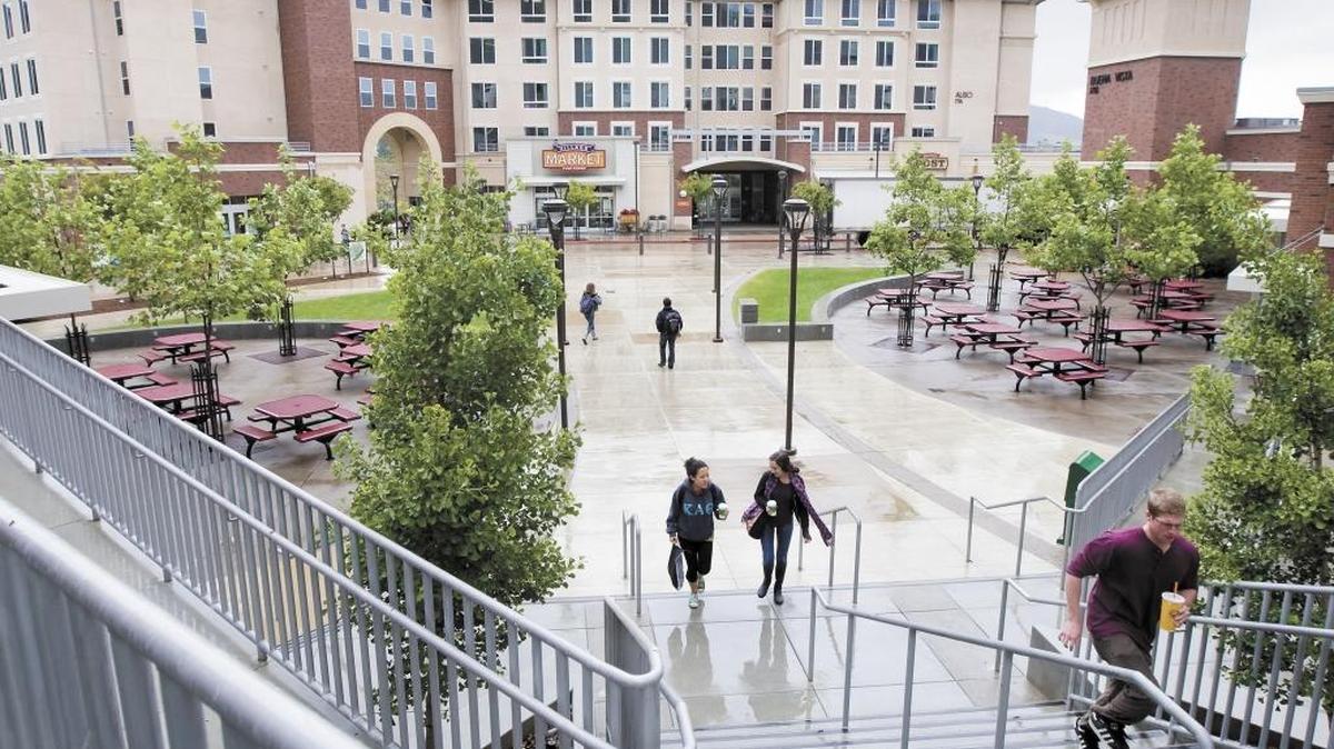 Students walk through Poly Canyon Village at Cal Poly.