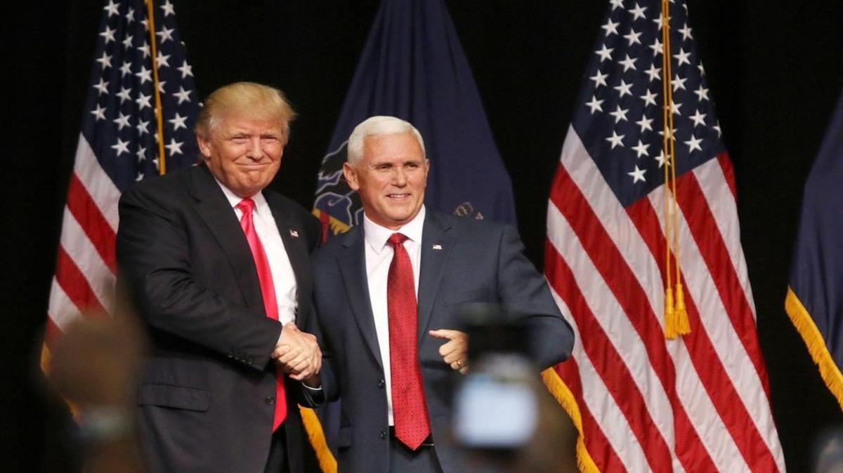 Presidential Donald Trump, left, and Vice President Mike Pence shake hands during a campaign stop in Lackawanna College Student Union in Scranton, Pa., Wednesday, July 27, 2016.