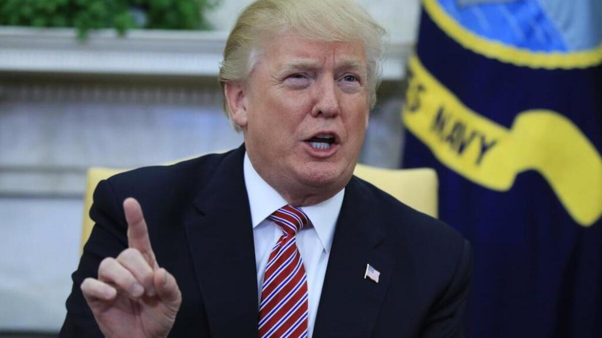 President Donald Trump speaks about domestic violence during a working session regarding the opportunity zones provided by tax reform in the Roosevelt Room of the White House, Wednesday, Feb. 14, 2018, in Washington.