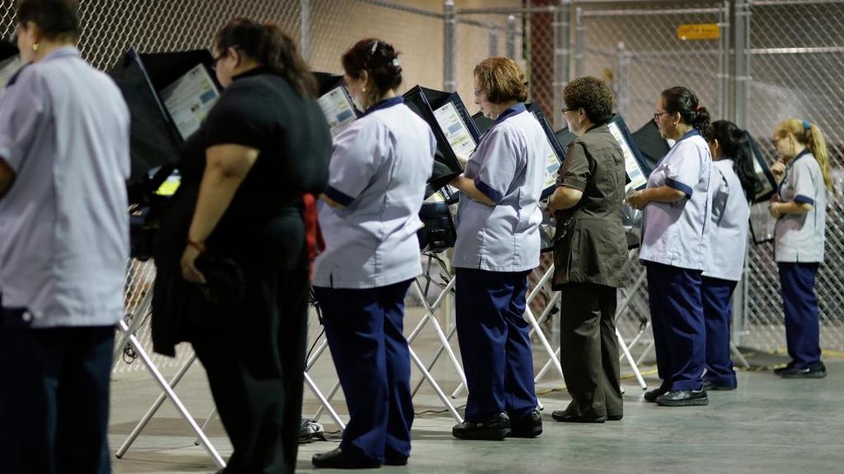 Casino workers vote Oct. 26 at an early voting site in Las Vegas.