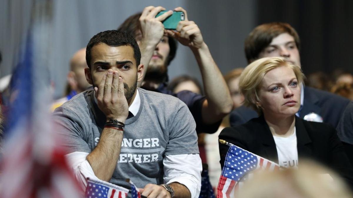 Hillary Clinton supporters react as results come in at an election night party for the Democratic presidential candidate at the Jacob K. Javits Convention Center in New York, late on Tuesday, Nov. 8, 2016.