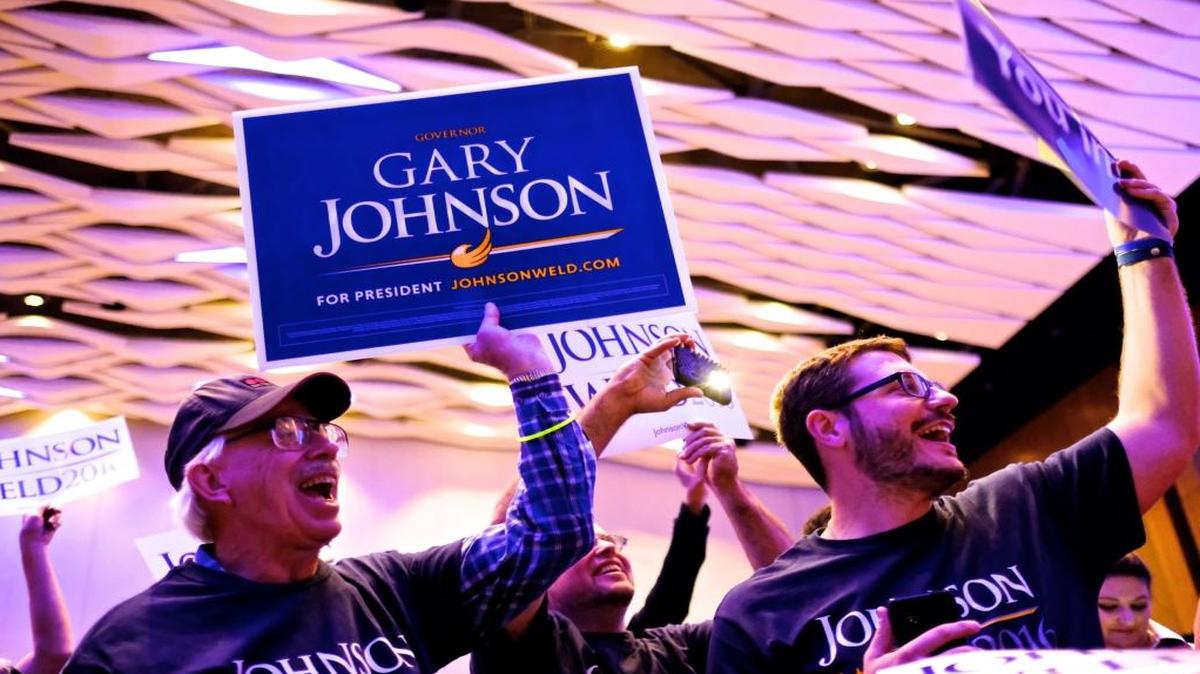 Supporters cheer as Libertarian presidential candidate Gary Johnson enters the stage during a campaign stop at the Cobo Center on Friday, October 28, 2016, in Detroit.