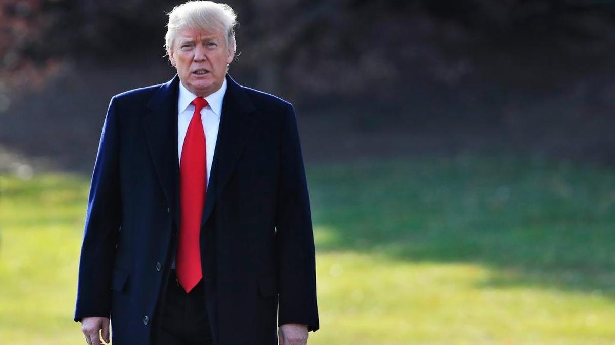 President Donald Trump walks on the South Lawn as he leaves the White House in Washington, Thursday, Dec. 21, 2017, to visit Walter Reed National Military Medical Center in Bethesda, Md.