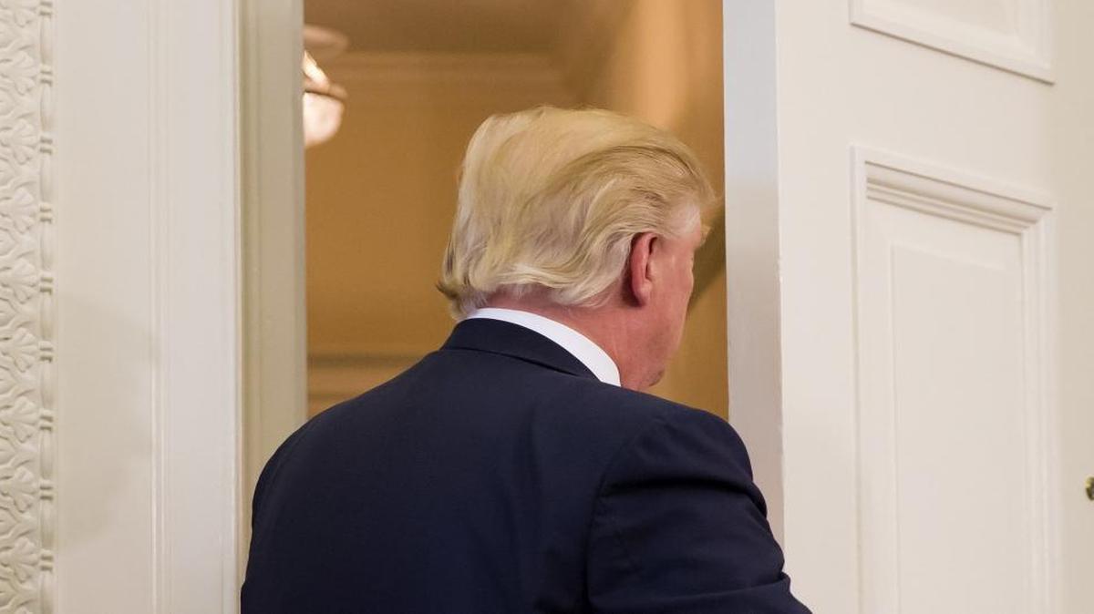President Donald Trump leaves the Oval Office after speaking, at the White House in Washington, D.C., on March 31, 2017.