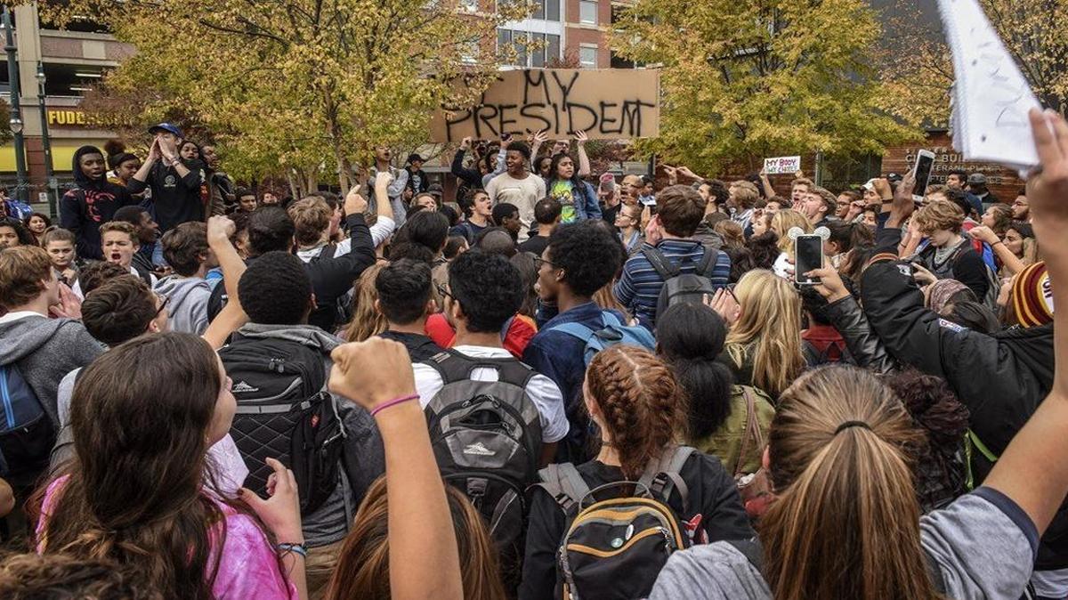 Students from three high schools gather along University Boulevard in the Washington suburb of Silver Spring, Maryland, to protest the election of Donald Trump on Nov. 14.