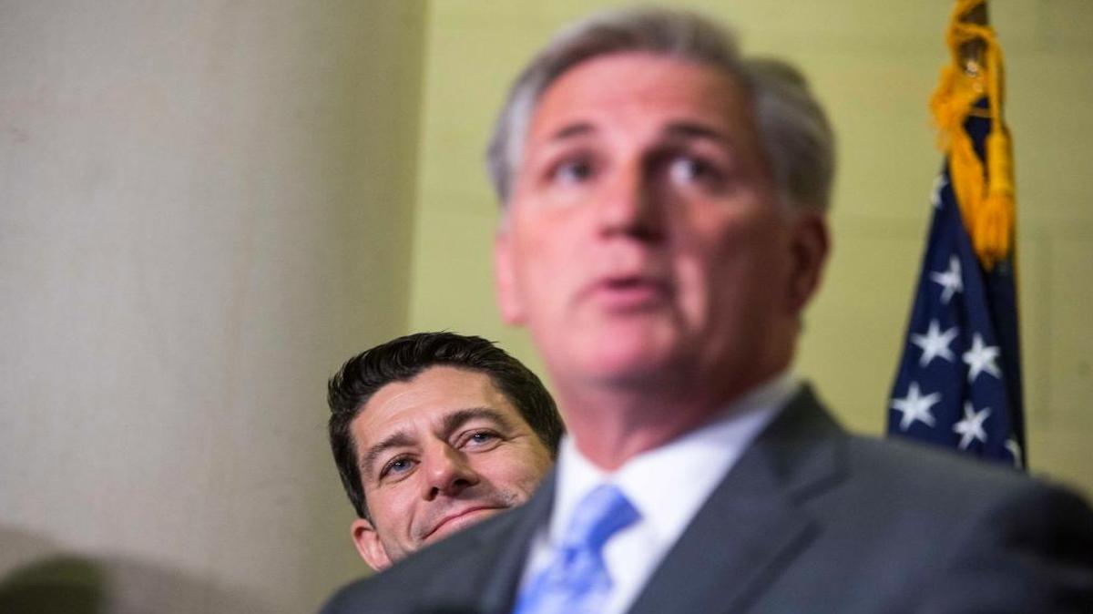 House Speaker Paul Ryan watches House Majority Leader Kevin McCarthy speak at a news conference on Capitol Hill in Washington, D.C., on Nov. 15, 2016.