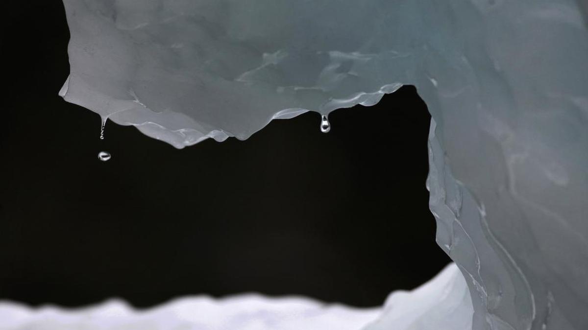 In this July 26, 2011 file photo, drops of water fall from a melting iceberg near Nuuk, Greenland.