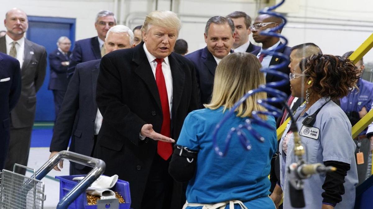 In this Dec. 1, 2016, file photo, President-elect Donald Trump greets workers during a visit to the Carrier Corp. factory in Indianapolis.