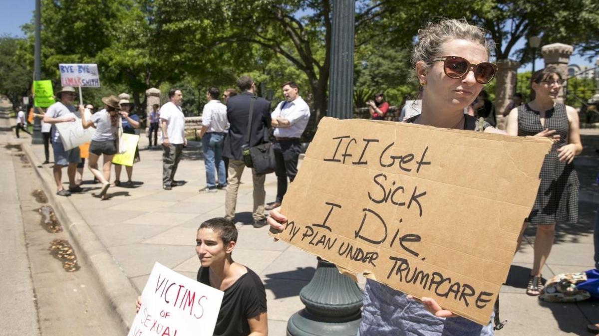 Sophia Donnelly protests the U.S. House passage of the plan to repeal and replace the Affordable Care Act at the south gate of the Capitol in Austin, Texas, on Friday May 5, 2017.