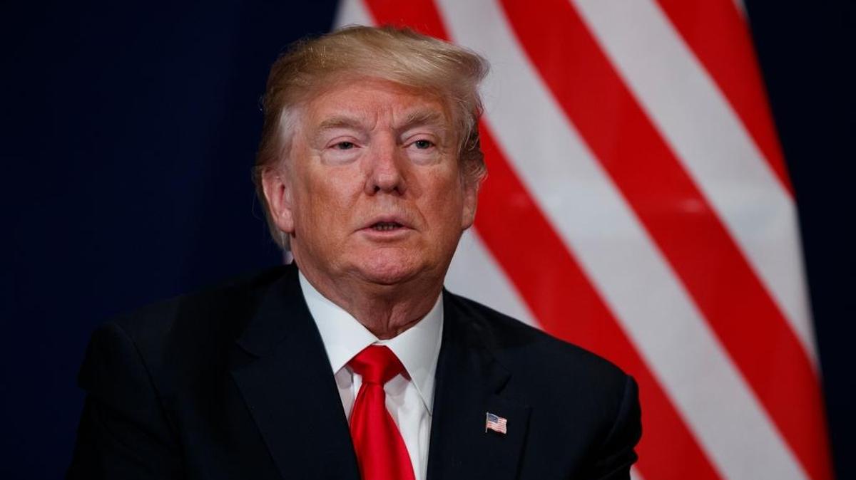 President Donald Trump listens during a meeting with Swiss President Alain Berset at the World Economic Forum, Friday, Jan. 26, 2018, in Davos.