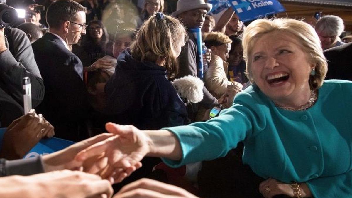 Democratic presidential candidate Hillary Clinton greets members of the audience at a rally at the Cleveland Public Auditorium in Cleveland on Sunday.