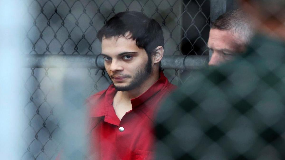 Esteban Santiago is taken from the Broward County main jail as he is transported to the federal courthouse in Fort Lauderdale, Fla., on Jan. 9.