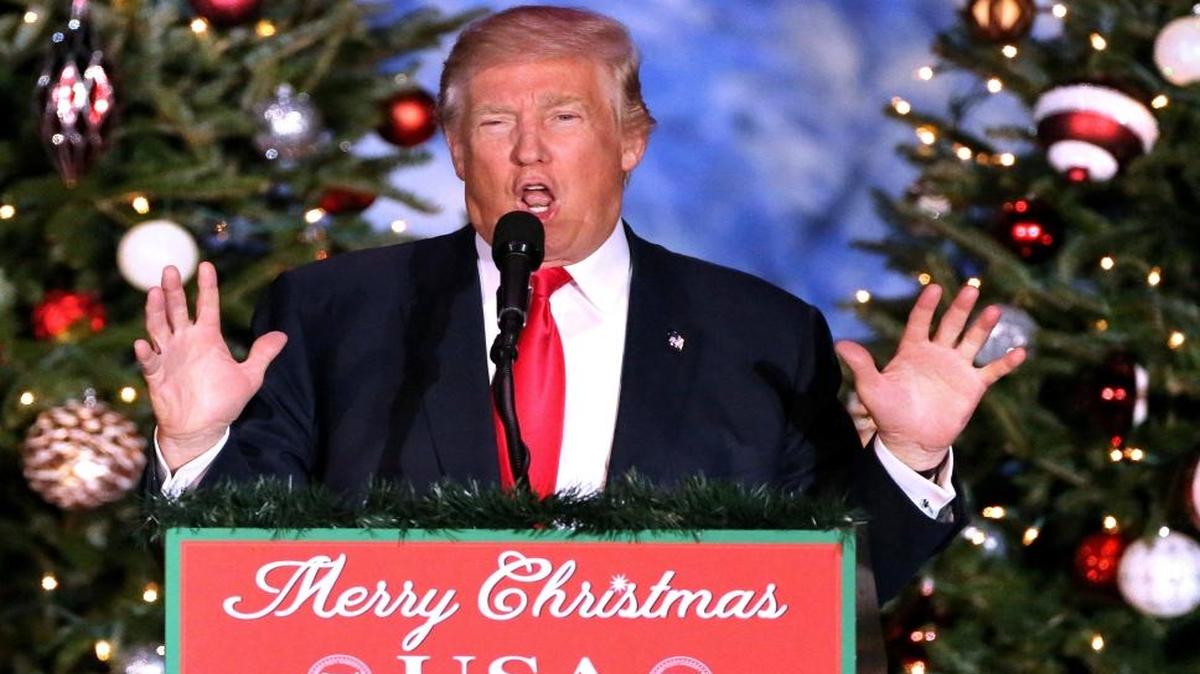 President-elect Donald Trump delivers remarks to cheering supporters in front of a Christmas-themed backdrop at a rally in Orlando, Fla., on Friday, Dec. 16, 2016.