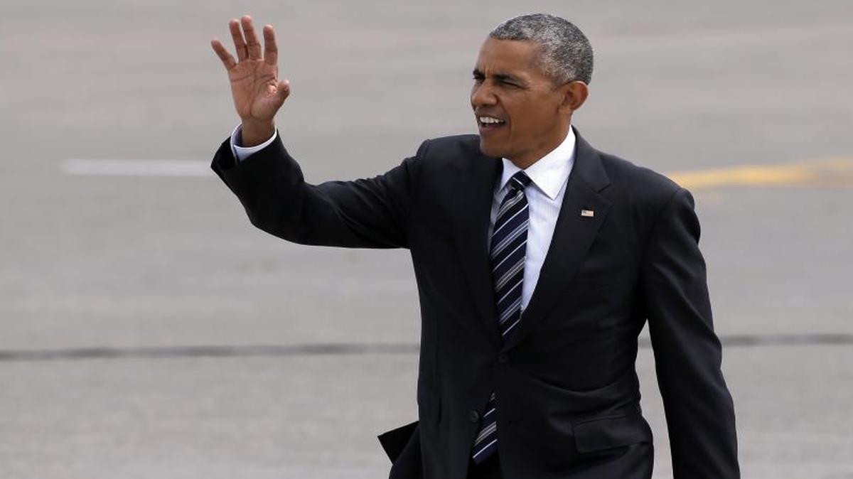President Barack Obama waves on his arrival Friday, June 24, 2016, at Seattle-Tacoma International Airport in SeaTac, Wash.