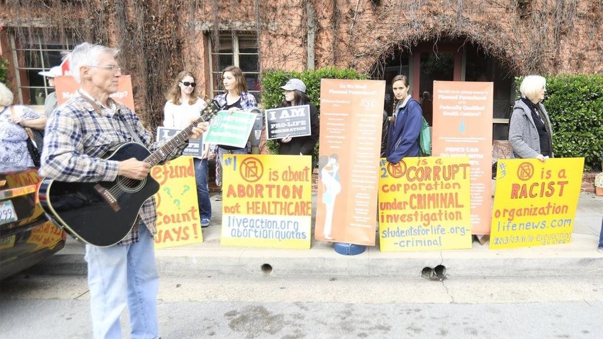Concerned citizens organized to protest Planned Parenthood, Saturday, February 11, 2017, while a counterprotest was held in support of Planned Parenthood across the street.