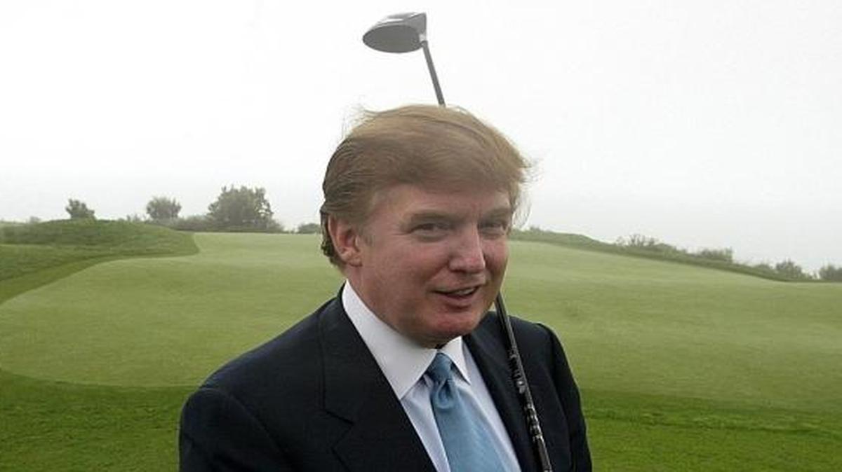 Donald Trump holds a driver up at Ocean Trails Golf Club in Rancho Palos Verdes in 2002.