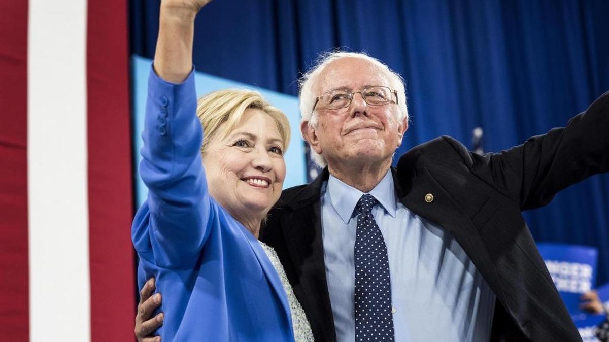 “I intend to do everything I can to make certain she will be the next president of the United States,” Bernie Sanders said of Hillary Clinton at a rally in Portsmouth, N.H.