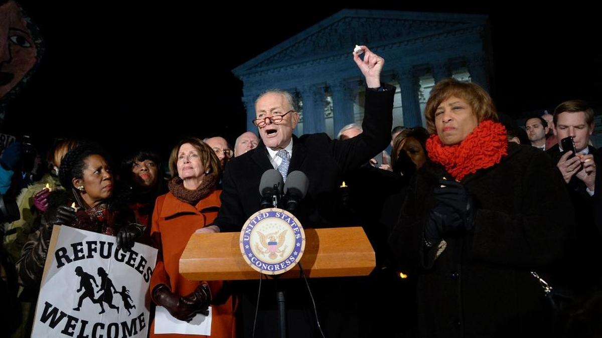 Senate and House Democrats, including Charles Schumer and Nancy Pelosi, address President Donald Trump's executive orders on Monday, Jan. 30, 2017 in front of the Supreme Court in Washington, D.C.