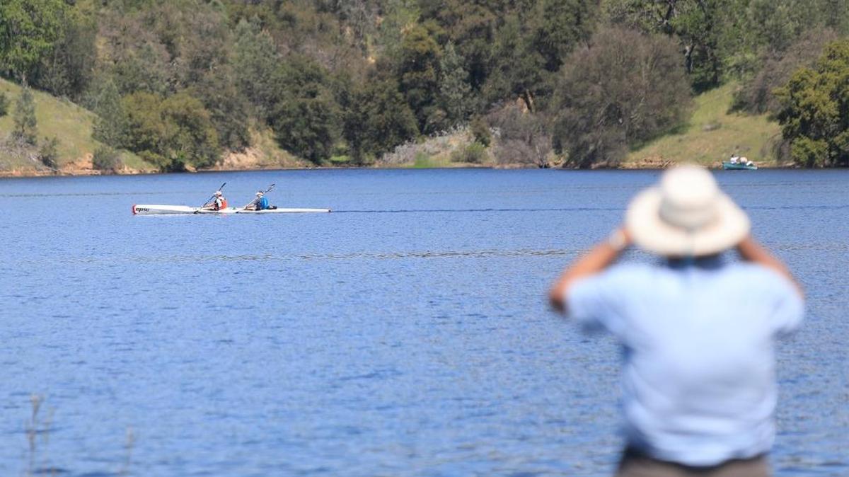 The 12th annual Checkpoint Challenge race at Santa Margarita Lake. Spectators watch race participants in the distance.