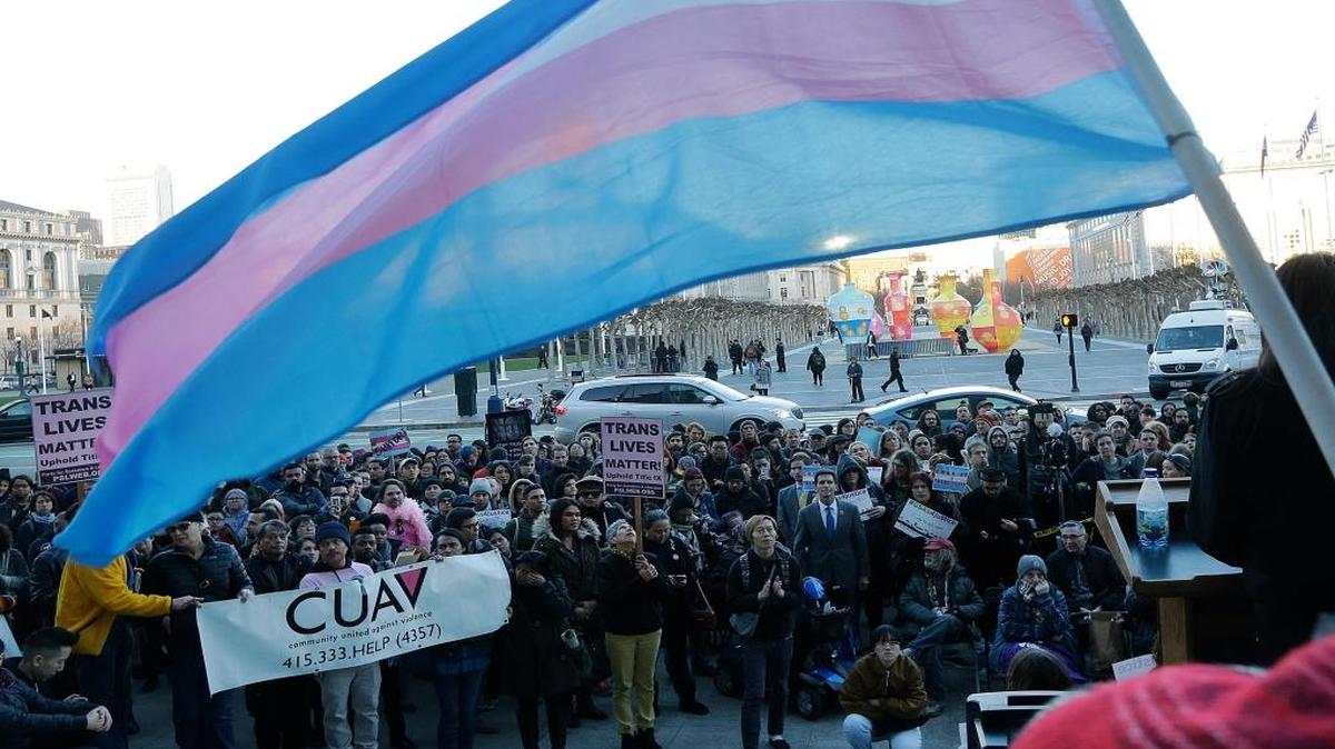 A crowds listens to speakers during a rally Feb. 23, 2017, at City Hall in San Francisco against President Donald Trump’s decision to roll back a federal rule saying public schools had to allow transgender students to use the bathrooms and locker rooms of their chosen gender identity.