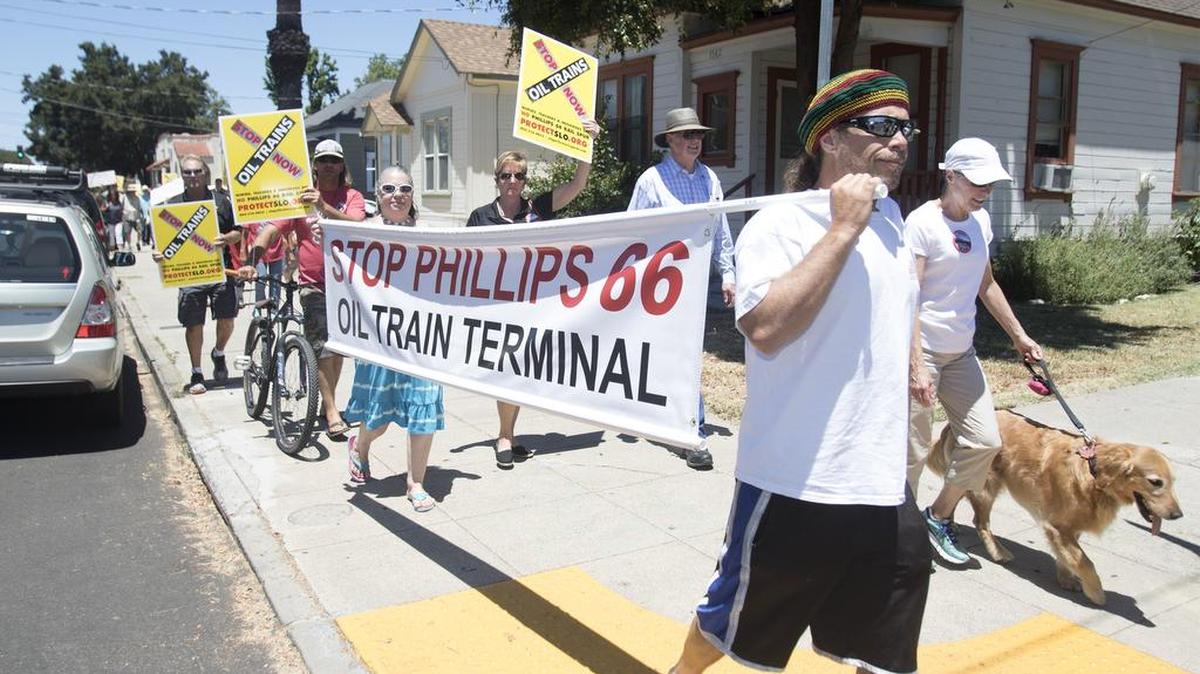 A rally protesting Phillips 66’s proposal to bring crude oil by rail to its Nipomo refinery was held in San Luis Obispo on Saturday, July 9, 2016. Here, protesters march down Santa Barbara Street toward the Amtrak train station.