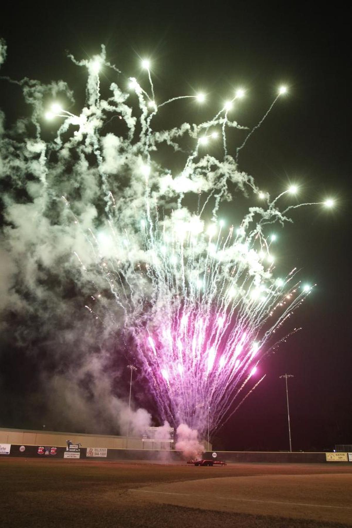 A packed stadium enjoys the firework show after the SLO Blues baseball team beat Menlo Park Legends on Friday, July 3, 2015.