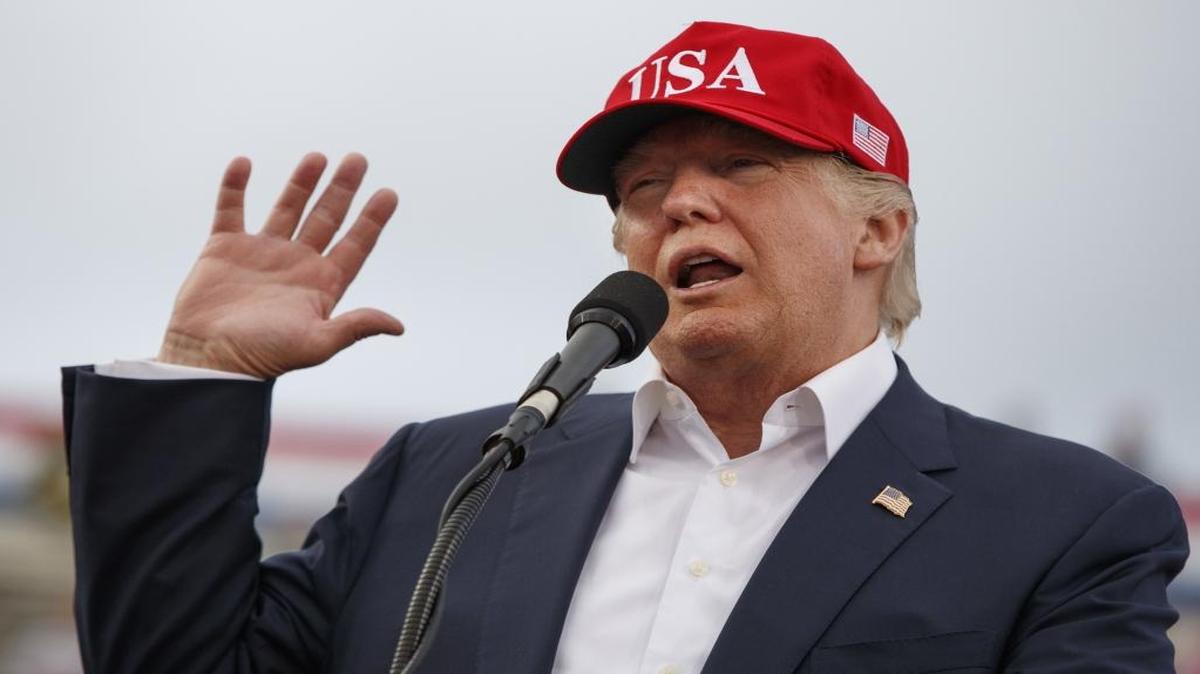 In this Saturday, Dec. 17, 2016 file photo, U.S. President-elect Donald Trump speaks during a rally at Ladd-Peebles Stadium in Mobile, Ala.