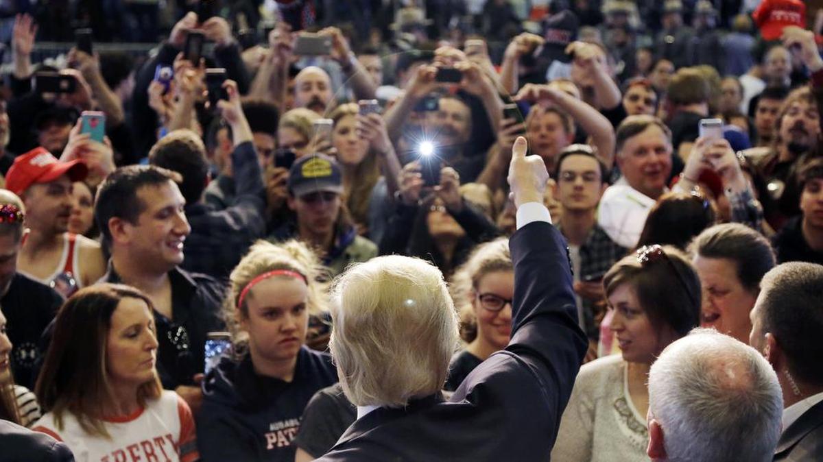 Republican presidential candidate Donald Trump gives a thumbs up to supporters at a campaign rally Friday in Plattsburgh, N.Y.