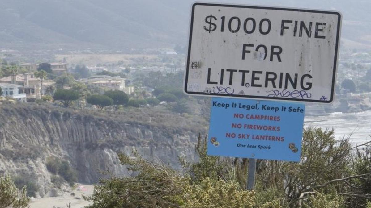 Litter near no littering signs is common at Pirate’s Cove.