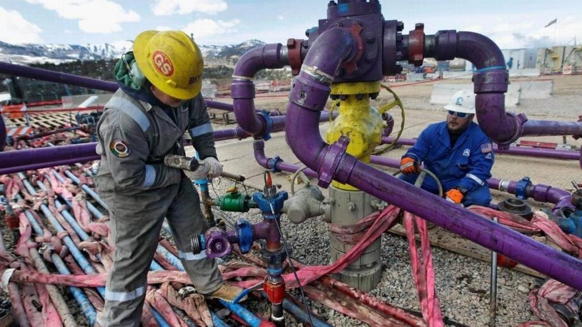 Workers tend to a wellhead at a hydraulic fracturing operation outside Rifle, in western Colorado. The Trump administration is considering opening 1.6 million acres of public land in California to fracking and convention oil drilling.