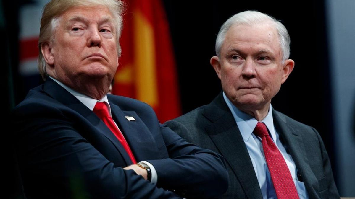 President Donald Trump sits with Attorney General Jeff Sessions during the FBI National Academy graduation ceremony, Friday, Dec. 15, 2017, in Quantico, Va.