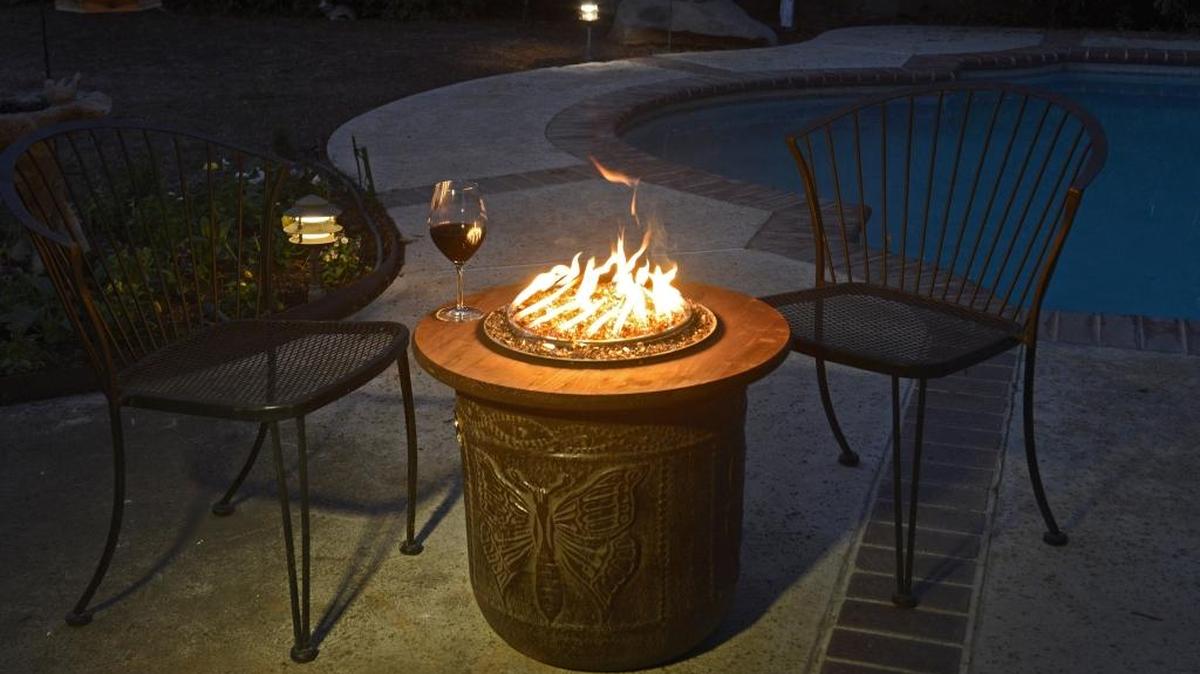This portable propane fire pit was made using a large flower pot and a kit purchased online.