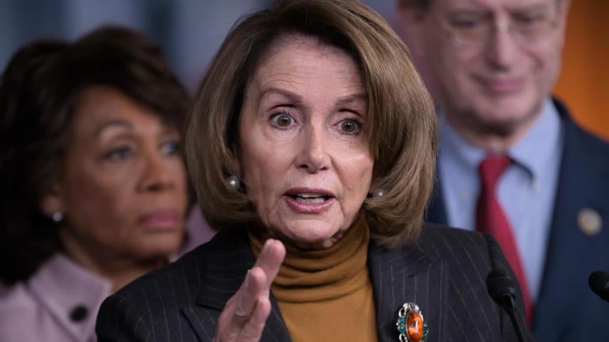 House Minority Leader Nancy Pelosi of California, center, joined by Rep. Maxine Waters, D-Calif., left, and Rep. Brad Sherman, D-Calif., speaks during a news conference on Capitol Hill in Washington on Feb. 6, 2017.