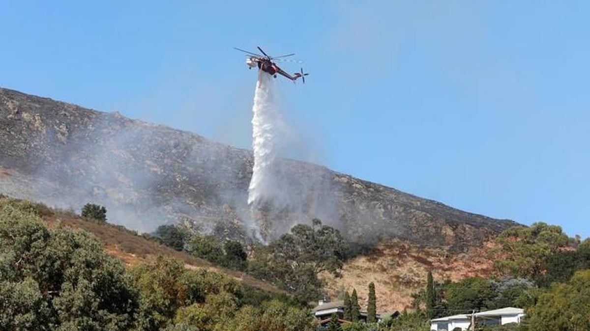 Cal Fire crews are battling a spot fire that flared up outside of the fireline of the Cal Poly fire on Wednesday afternoon.