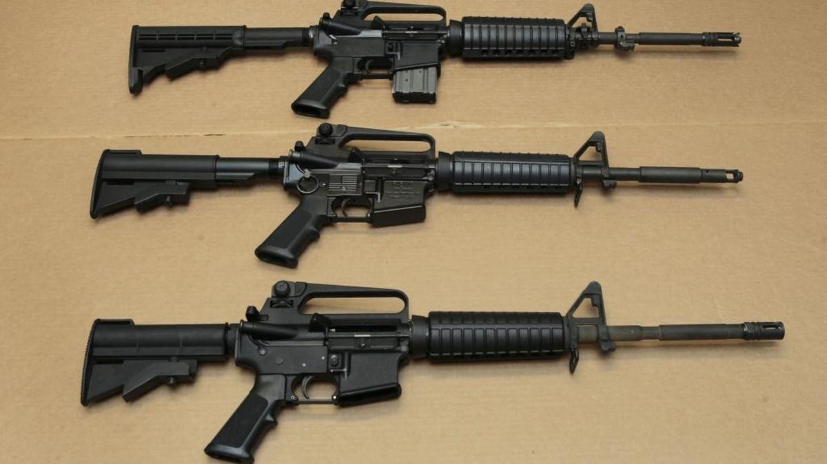 Three variations of the AR-15 assault rifle are displayed at the California Department of Justice in Sacramento. While the guns look similar, the bottom version is illegal in California because of its quick reload capabilities.