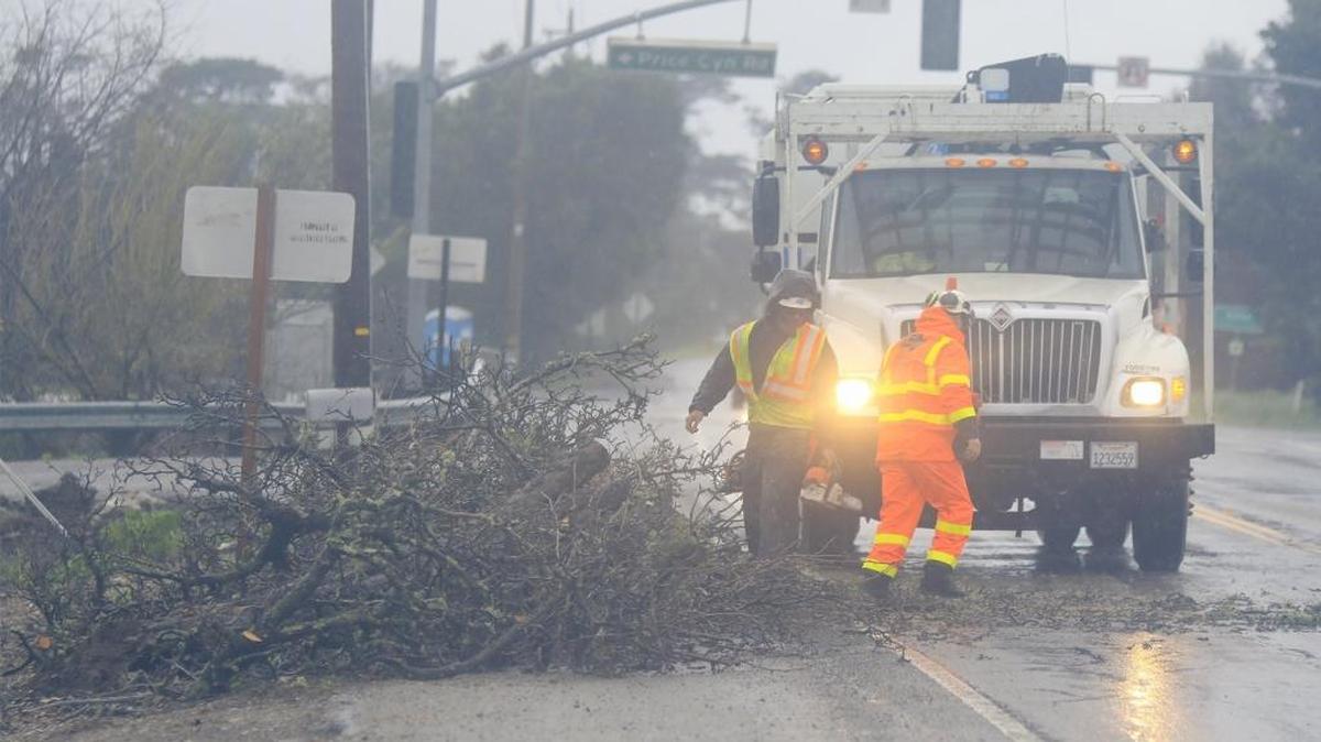 A windy storm knocked down multiple trees across San Luis Obispo County on Feb. 17. Caltrans crews clear a tree that had fallen onto Highwy 227 at Price Canyon Road.
