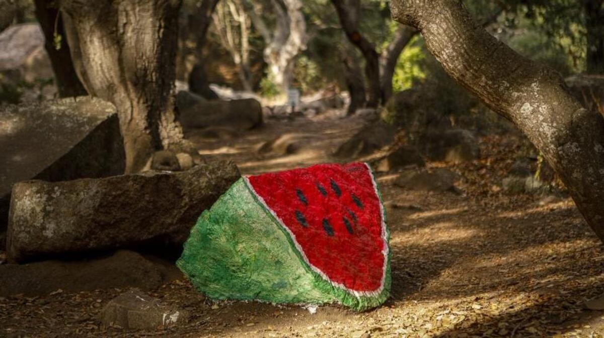 A rock along the Bishop Peak trail near Highland Drive was painted to look like a slice of watermelon.