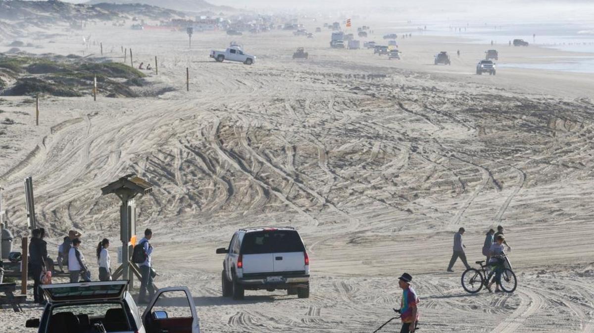 Warm weather in December 2016 brought beachgoers to the dunes in Oceano near the Pier Avenue ramp.