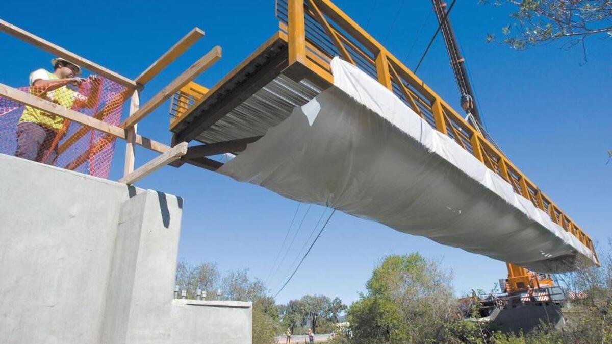 Robert Farnsworth clears the landing zone for a bridge on the Bob Jones Trail in March 2014. The bridge crosses Prefumo Creek near Highway 101 and Los Osos Valley Road.