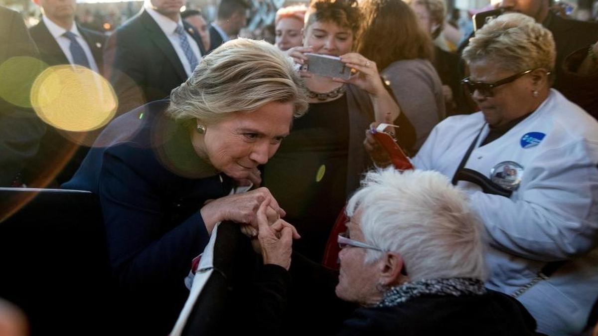 Democratic presidential candidate Hillary Clinton greets a member of the audience after speaking at a rally at Eastern Market in Detroit on Friday.
