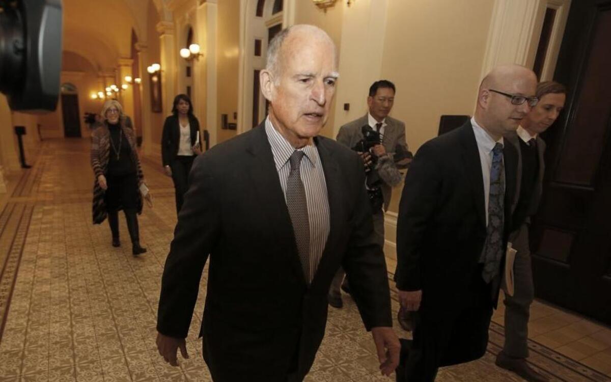 California Gov. Jerry Brown returns to his office after meeting with the Senate Democratic Caucus to urge them to approve a transportation plan, Thursday, April 6, 2017, in Sacramento.