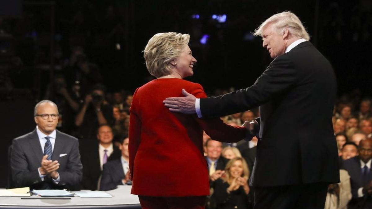 Democratic presidential nominee Hillary Clinton and Republican presidential nominee Donald Trump shake hands during the first presidential debate at Hofstra University in Hempstead, N.Y.