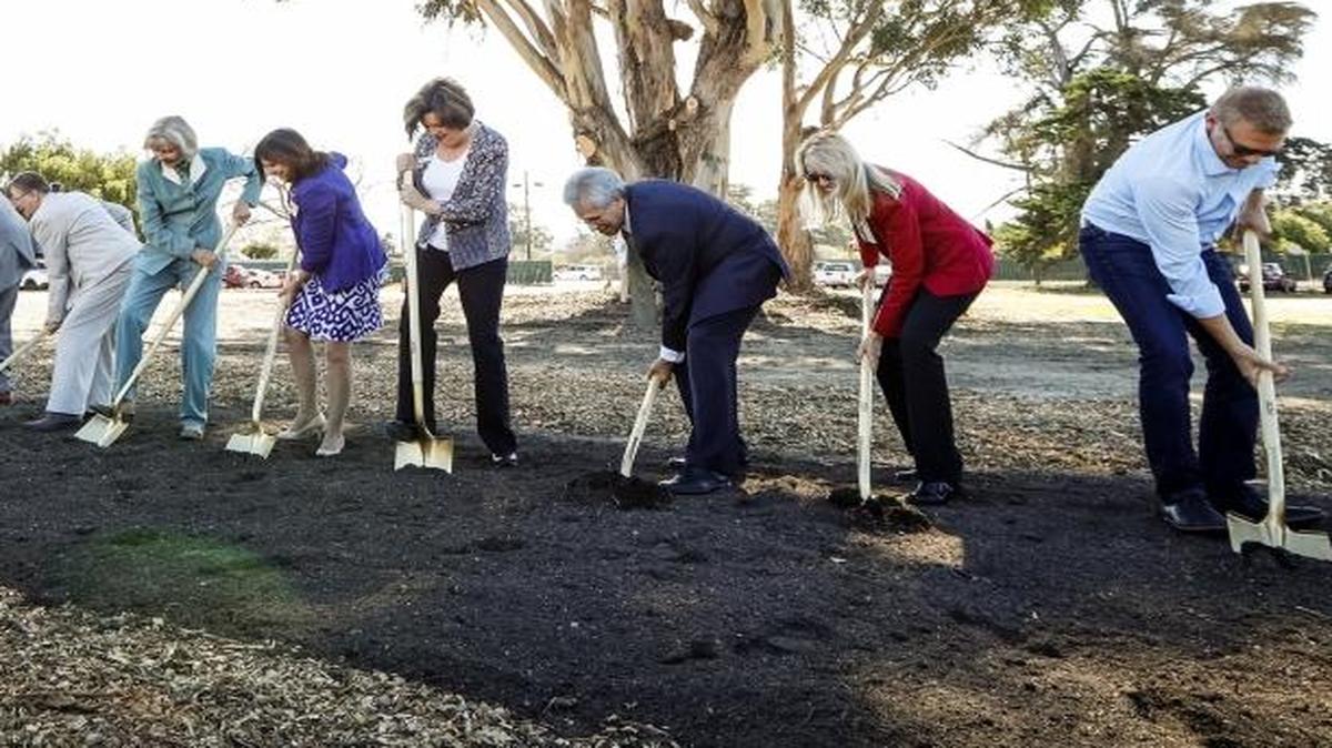 Elected officials and homeless service providers dig in their shovels during the groundbreaking event for the new Homeless Services Center at 40 Prado in November.