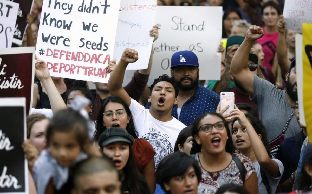 Protesters gather to demonstrate against changes in the Deferred Action for Childhood Arrivals (DACA) immigration policy at City Hall in Los Angeles on September 5, 2017. President Trump decided to phase out the Deferred Action for Childhood Arrivals program.