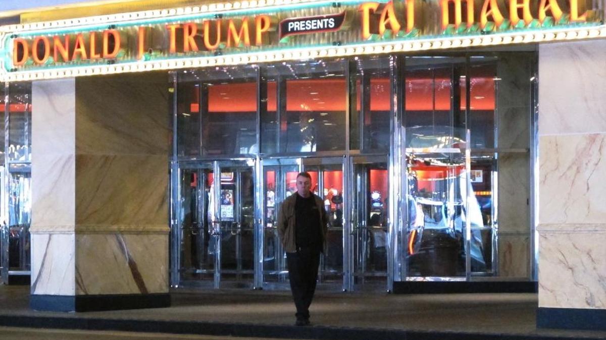 In this May 17, 2016, photo, Sean Friel, a valet attendant, stands at the Trump Taj Mahal casino in Atlantic City, N.J,. since the day it opened in 1990.