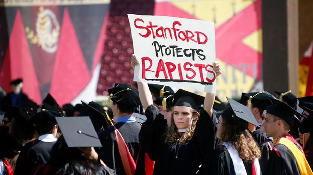 A graduating Stanford student holds a sign protesting the Brock Turner sentence during the start of the university’s commencement ceremony in Stanford on June 12.