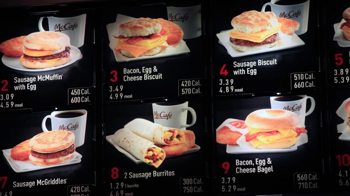 Items on the breakfast menu, including the calories, are posted at a McDonald’s restaurant in New York.
