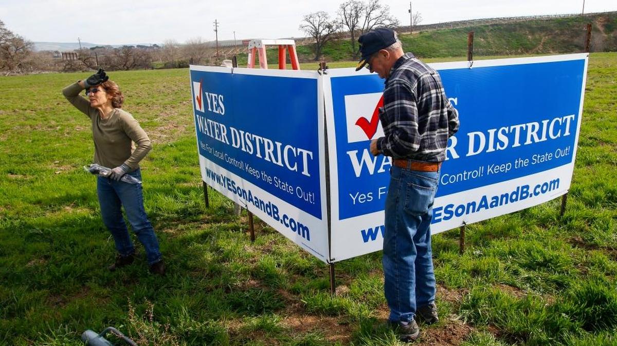 Laurie Gage and Dave King installed signs supporting the creation of the water district on San Marcos Road between Paso Robles and San Miguel.
