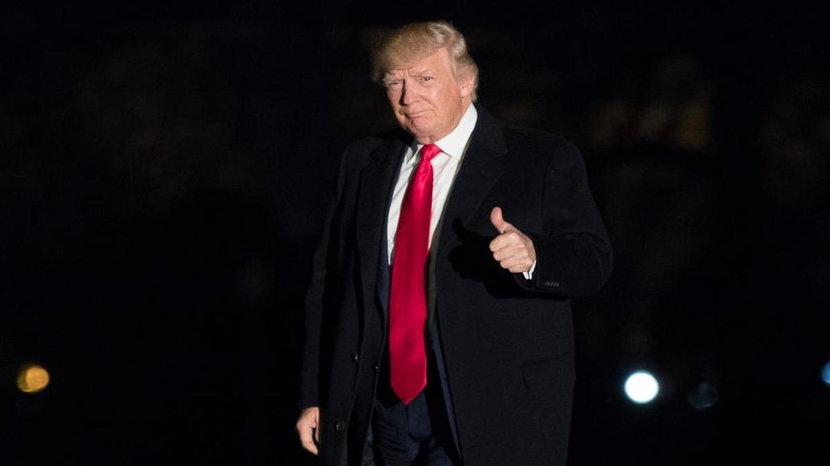 President Donald Trump gives a thumbs up to members of the media as he arrives at the White House in Washington, Monday, Feb. 20, 2017.